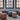 a set of wool pouf stools in an old building