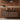 walnut midcentury wall storage unit with black lamp and vase