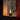 Small cylindrical lamp with a warm glow on a reflective surface