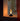Small cylindrical lamp with a warm glow on a reflective surface
