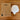 Tala Enno LED light bulb and its packaging on a wooden surface