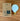 Tala light bulb and packaging on a wooden surface