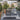 outdoor patio with neutral rugs and patio tables