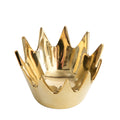 Gold crown-shaped decorative item on a white background
