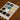 Color swatch book on a wooden surface