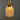 Close-up of a gold-colored lamp with a dark gray background
