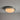 A round flush-mount Sergio Mazza ceiling light fixture with a textured frosted glass shade and a brushed silver metal rim, shown illuminated against a neutral gray ceiling.