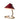 Table lamp with red shade and brass base on a white background