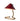 Table lamp with red shade and brass base on a white background