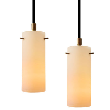 Two pendant lights with cylindrical glass shades on a white background for Two Enlighten