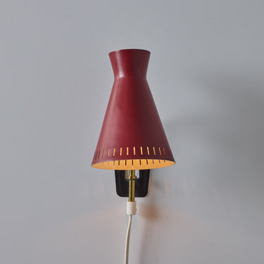 V3454 1950s Perforated Red Diabolo Plug-In Wall Lamp Attributed to Mauri Almari for Two Enlighten