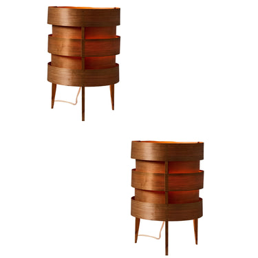 Two wooden vintage  Hans Agne Jakobsson bent plywood table lamps against a white background