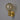 Wall-mounted light fixture with a spherical glass shade and gold finish on a gray background