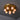 Ceiling light fixture with six round bulbs on a dark ceiling