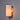Wall-mounted light fixture with a cylindrical shade on a gray wall.
