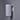 White cylindrical wall light fixture on a gray wall