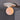 Ceiling light fixture with a spherical bulb on a gray ceiling