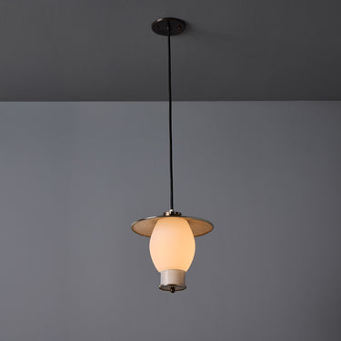 Pendant light with a glass shade on a gray background