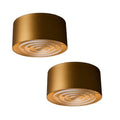 Two gold cylindrical midcentury lights on a white background