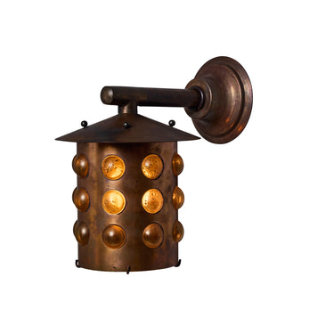 Bronze wall sconce with circular design on a white background