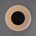 Round light fixture with a black center on a gray background
