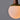 Close-up of a light pendant with a wooden base on a gray background