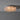 Ceiling light fixture with textured glass shade on a gray background