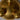 Close-up of a gold object with a crown emblem on a gray background