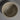 A top-down view of a speckled ceramic bowl with a matte, earthy beige finish, set against a minimalist gray background.