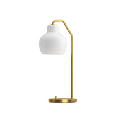 VL ring crown table lamp with white shade and gold metal base on a white background from Louis Poulsen