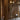Wooden interior with hanging clothes and decorative portable glass VL45 lamps louis poulsen at two enlighten