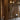 Wooden interior with hanging clothes and decorative portable glass VL45 lamps louis poulsen at two enlighten