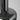 Close-up of a metallic chrome VL56 pendant with a reflective surface on a gray background
