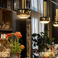 Vilhelm Lauritzen brass 'VL 56' Pendant for Louis Poulsen at two enlighten installed over a bar