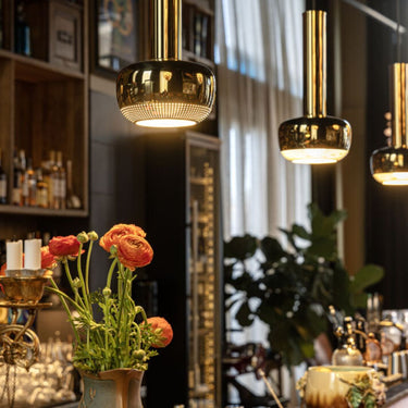 Vilhelm Lauritzen brass 'VL 56' Pendant for Louis Poulsen at two enlighten installed over a bar