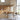 Modern dining area with Carl Hansen wooden table and chairs in a bright room.