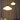Two pendant lights hanging above a table with decorative items against a beige curtain background.
