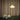 Pendant light fixture hanging above a table with decorative vases against a curtain backdrop