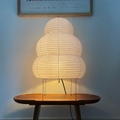 akari24N lamp lit on wood table