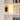 Bookshelf with books and a wall lamp in a room setting