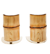 Pair of wooden bookends with gold accents on a white background