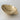 brass ashtray or catchall on a light gray background