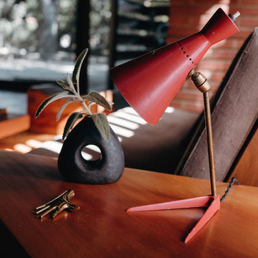 aubock vase and italian midcentury lamp on a warm wood table