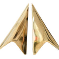 Gold star-shaped bookends on a white background