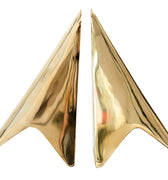 Gold star-shaped bookends on a white background