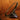 brass bookend on a wooden stand against a wooden background