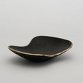 3979 aubock brass curved dish on gray background