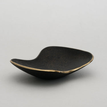 3979 aubock brass curved dish on gray background