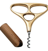 Gold corkscrew with wooden stopper on a white background