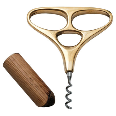 Gold corkscrew with wooden stopper on a white background